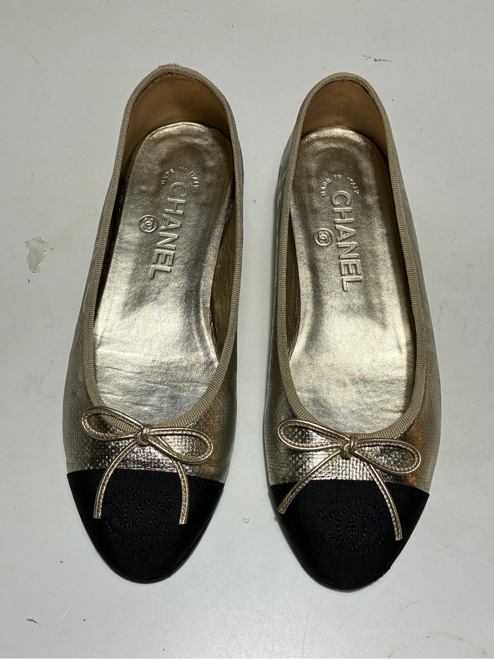 CHANEL Gold Metallic and Black Cap-Toe Ballet Flats